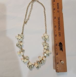 Statement necklace, delicate, with floral accent
